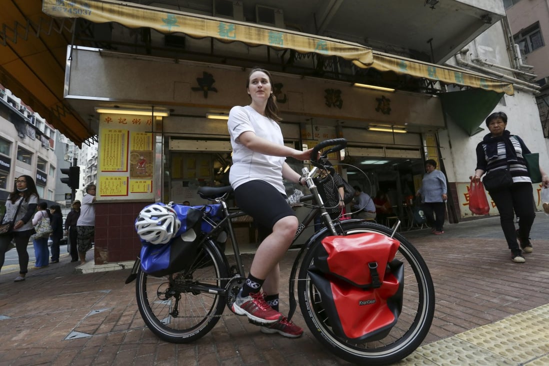 Julia Mason cycles through Kennedy Town, Hong Kong. Photo: Jonathan Wong