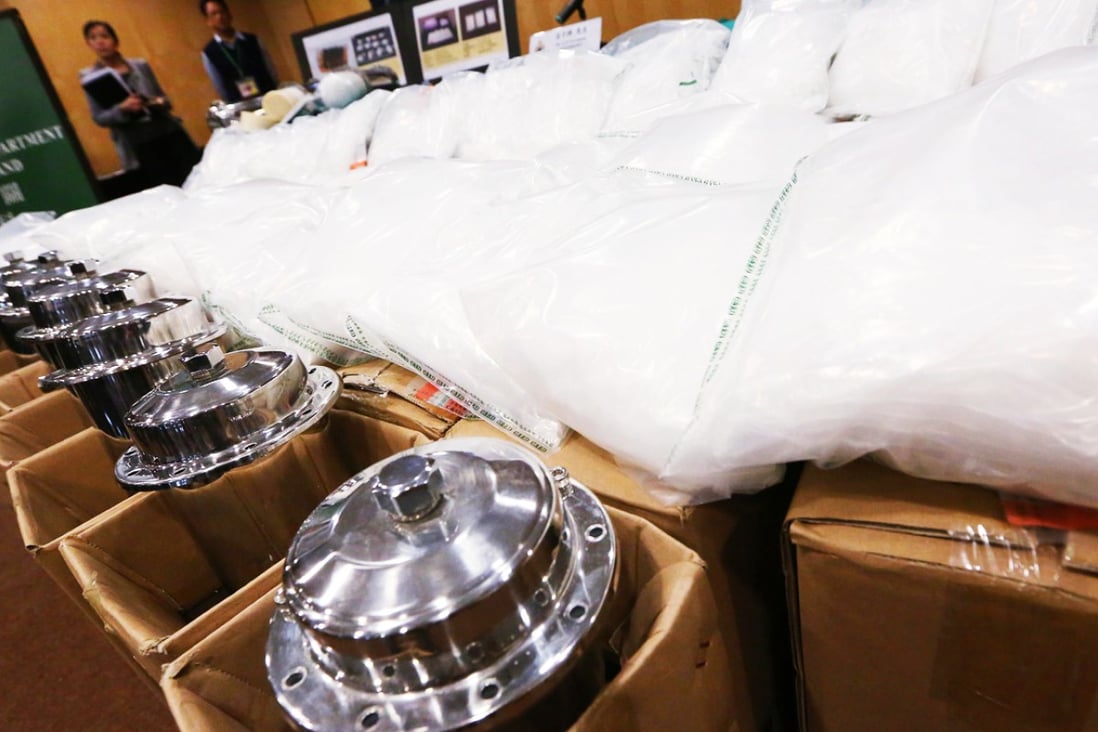 Customs officers with a 104kg haul of Ice seized at Chek Lap Kok in December last year. Photo: Felix Wong