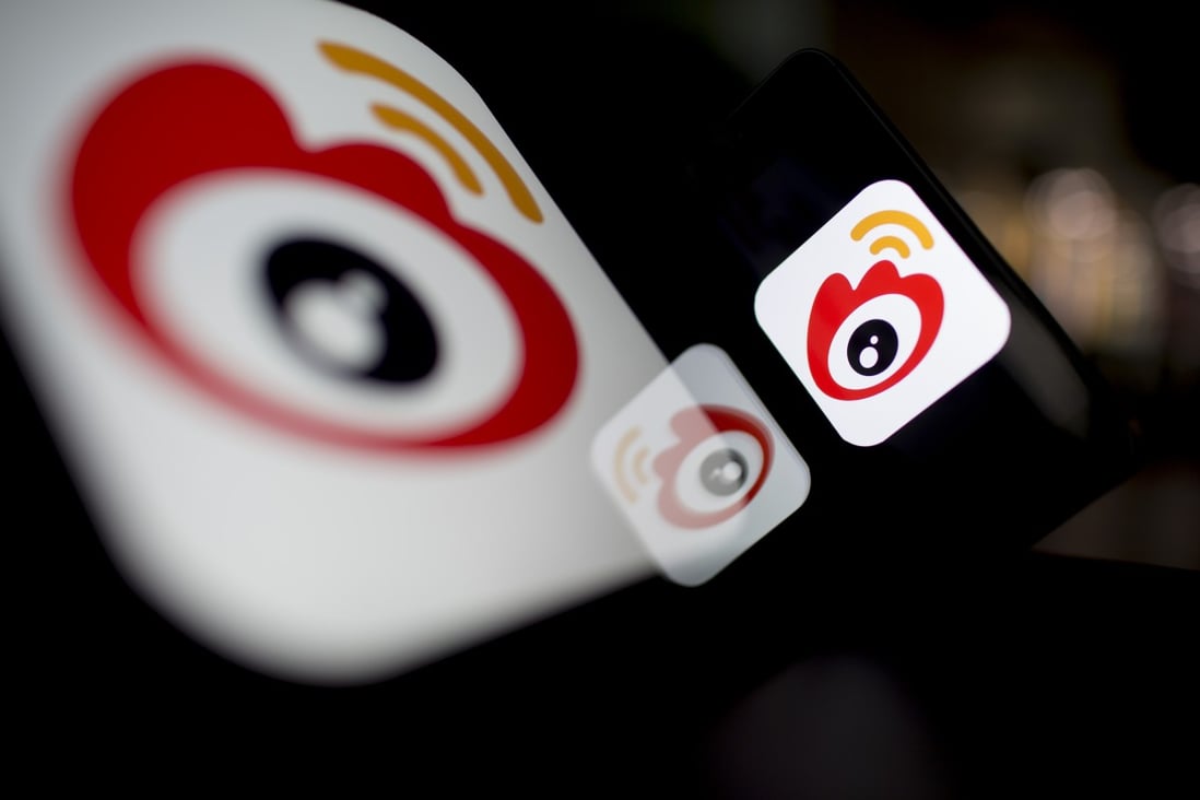 The logo of Sina Corp.'s Sina Weibo microblog service is displayed on an Apple iPad and iPhone. Photo: Bloomberg
