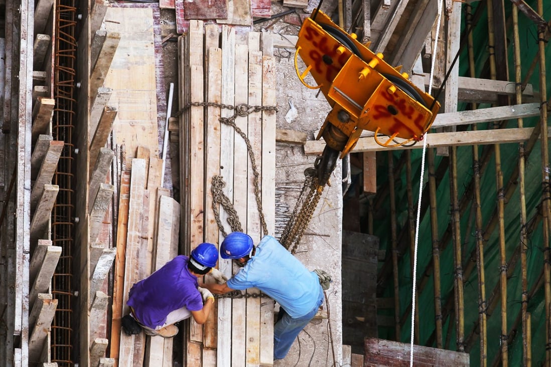 Construction workers can earn HK$1,100 to HK$1,300 a day.  Photo: Felix Wong