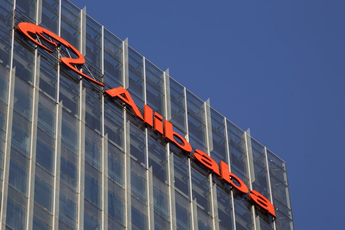 The Alibaba Group logo sits on top of a building developed by the Greenland Group in Beijing. Photo: Bloomberg
