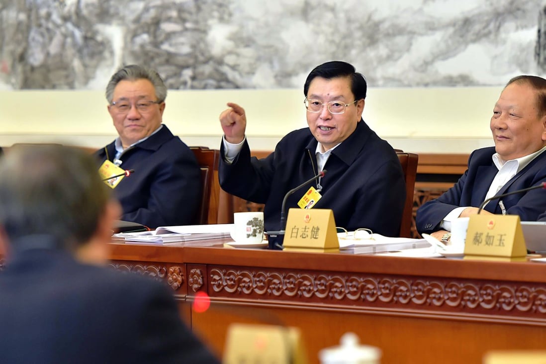 Zhang Dejiang (centre), chairman of the Standing Committee of China's National People's Congress, which will vote on the new draft law. Photo: Xinhua