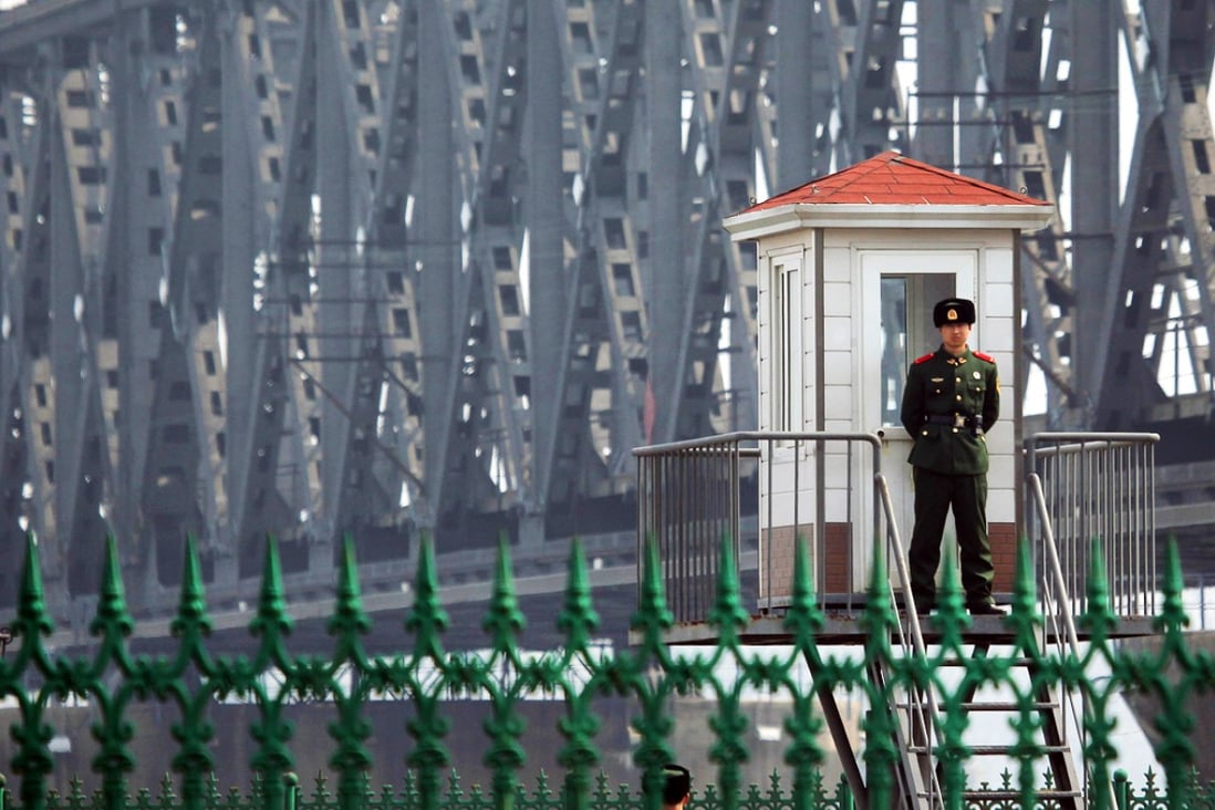 A Chinese guard on duty on the border with North Korea. Previous media reports have suggested North Korean soldiers are crossing the frontier to find food and steal money. Photo: AFP