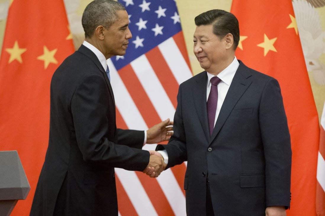 US President Barack Obama and Chinese President Xi Jinping shake hands after a meeting in Beijing last year. Both countries are still engaged in the 'great game' to advance their own interests as the two most powerful countries in the world. Photo: AP 