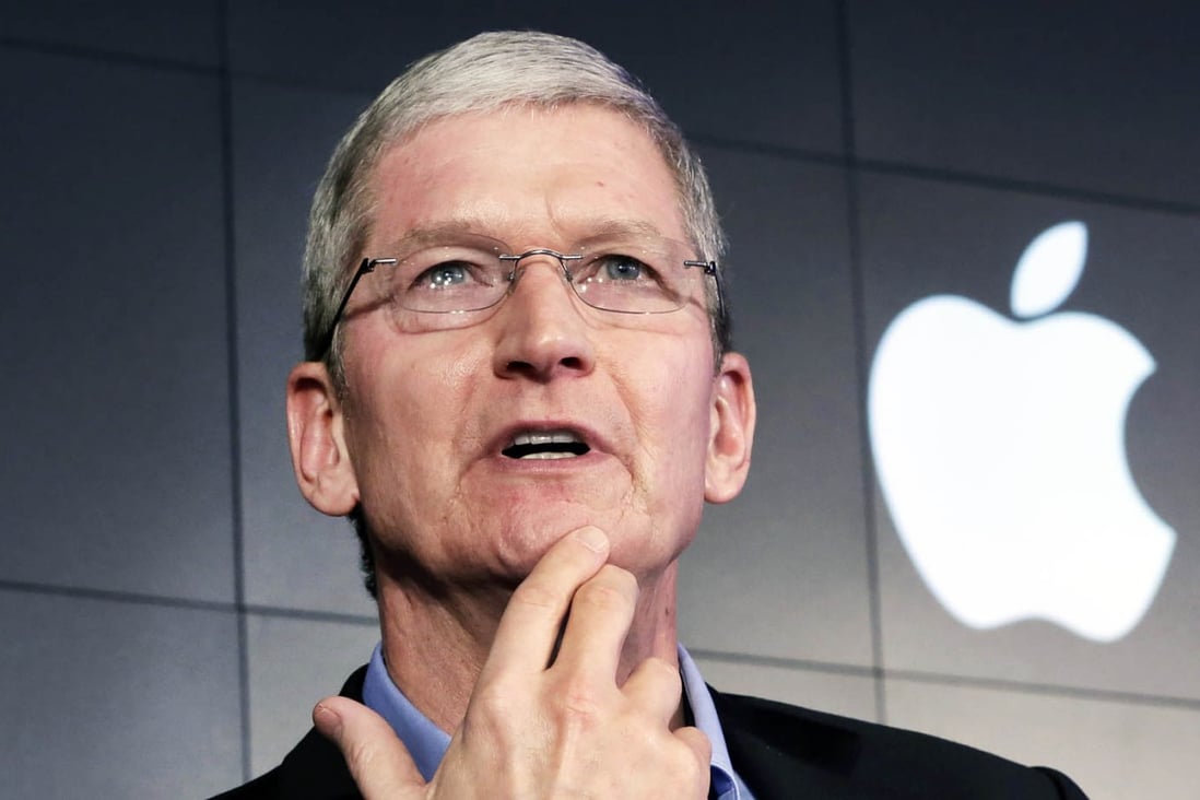 Apple CEO Tim Cook responds to a question during a news conference. Photo: Reuters