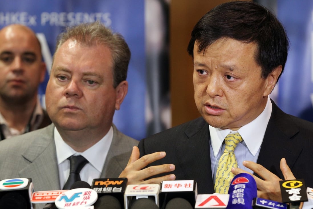 Hong Kong Exchanges and Clearing chief Charles Li (right) talks at a briefing as he expressed the hope the stock quota in the Shanghai-Hong Kong connect scheme will be increased soon and a link will be set up with China's commodity exchanges. 