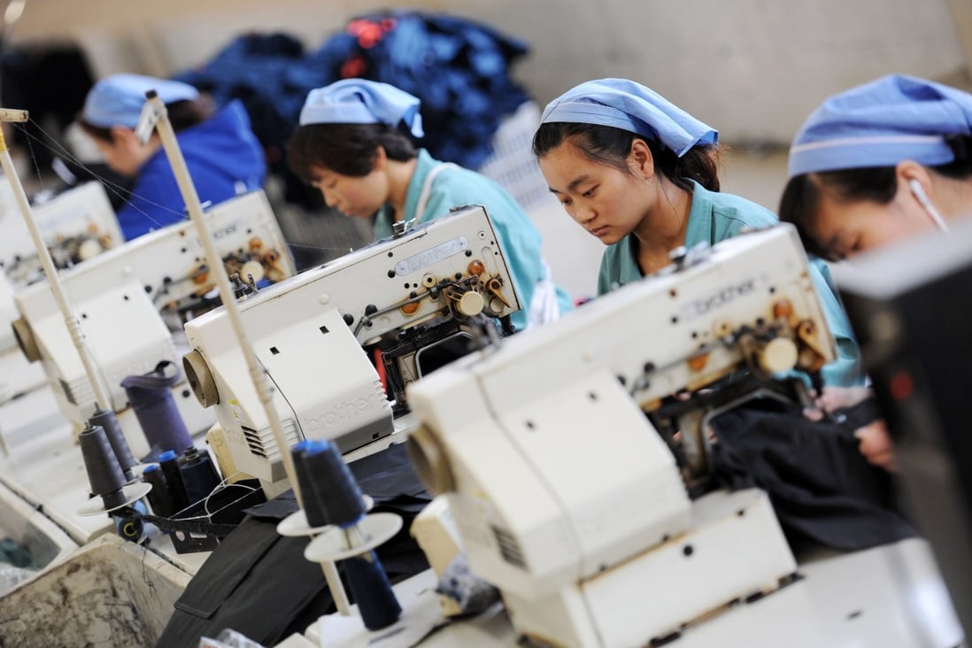 Workers produce clothes in a factory in China's Anhui province. Photo: AFP