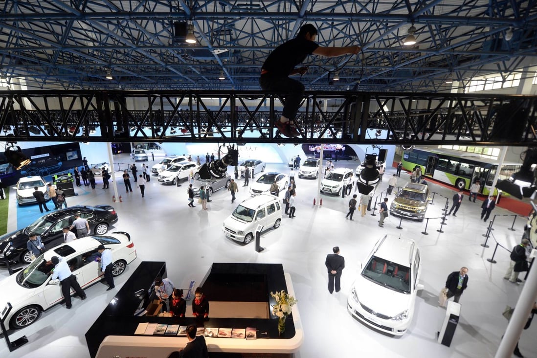 Vehicles are displayed at the 18th China Beijing International High-Tech Expo in the Chinese capital in May. Analysts say the government needs to create a level playing field to allow all types of businesses to flourish. Photo: AFP