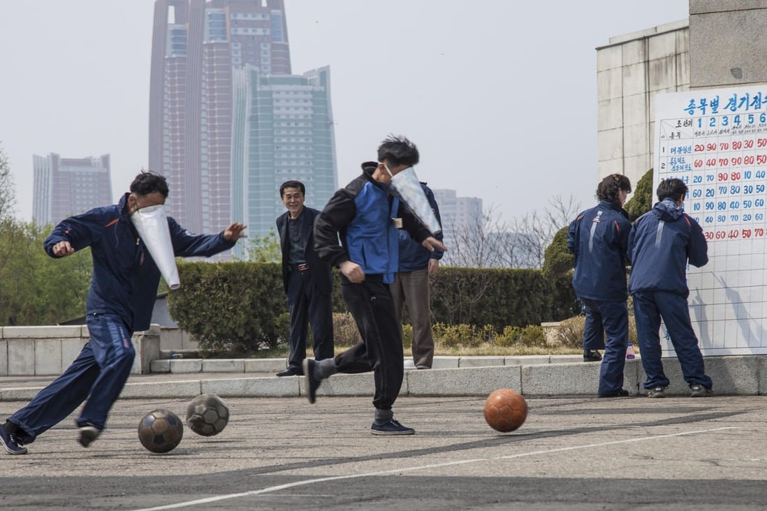 Staff from the Yanggakdo Hotel, in Pyongyang, play cone-faced football. Photos: Ayesha Sitara