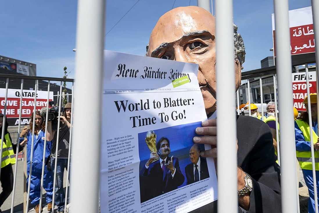 A demonstrator disguised as Fifa President Sepp Blatter takes part in a protest against the condition of workers in Qatar in Zurich. Photo: AFP