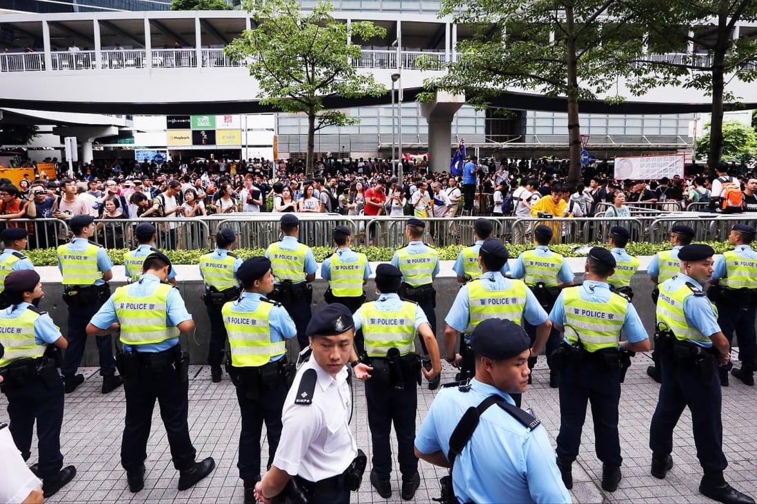 Police officers stand guard outside the Legco complex. Photo: Felix Wong
