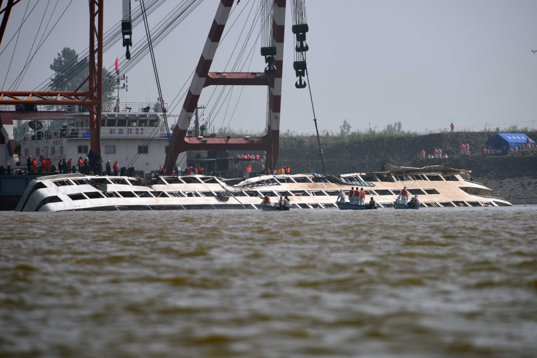 The sunken cruise ship Eastern Star is brought to the surface in the Jianli section of the Yangtze River in Hubei province. Photo: Xinhua 