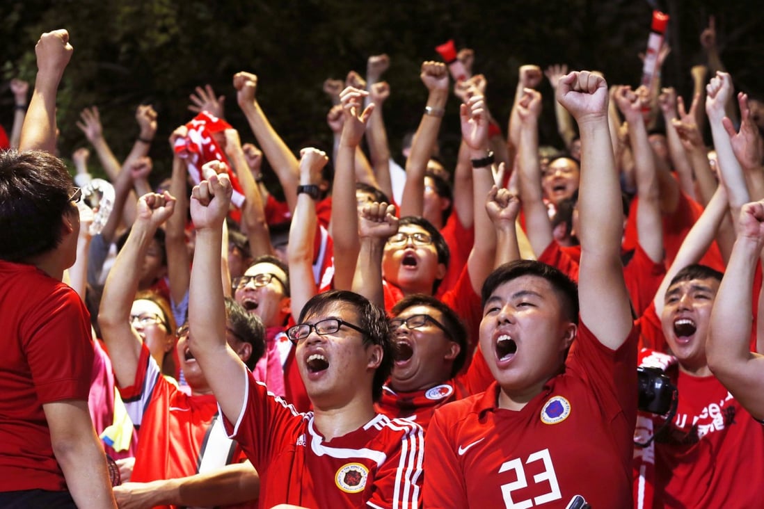 Hong Kong fans cheer a goal against Bhutan. Photo: AP