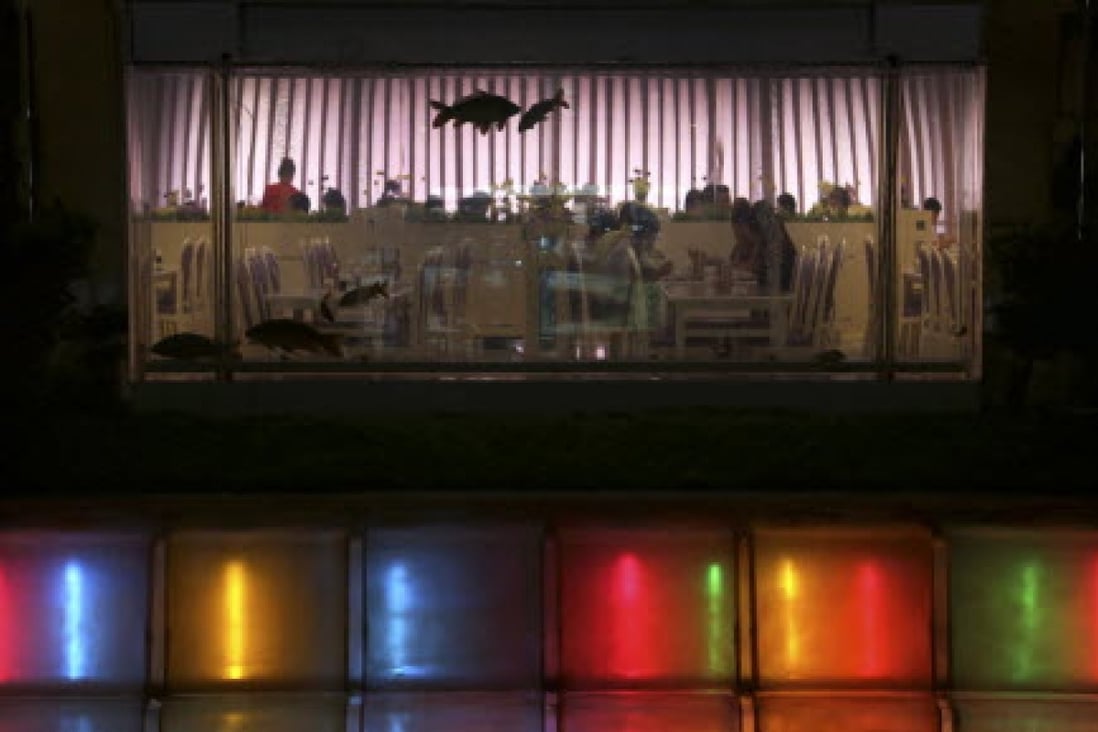 People dine in a restaurant at the Koryo Hotel in Pyongyang in 2013. The hotel caught fire on Thursday. Photo: AP