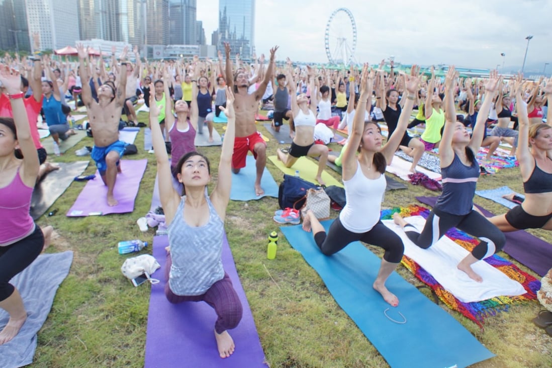 Om Together: more than 600 participants came together to stretch and sweat throughout the 90 minute yoga practice during the Green Summer Festival at Central Harbourfront Event Space in September 2014. Photo: Stretch City