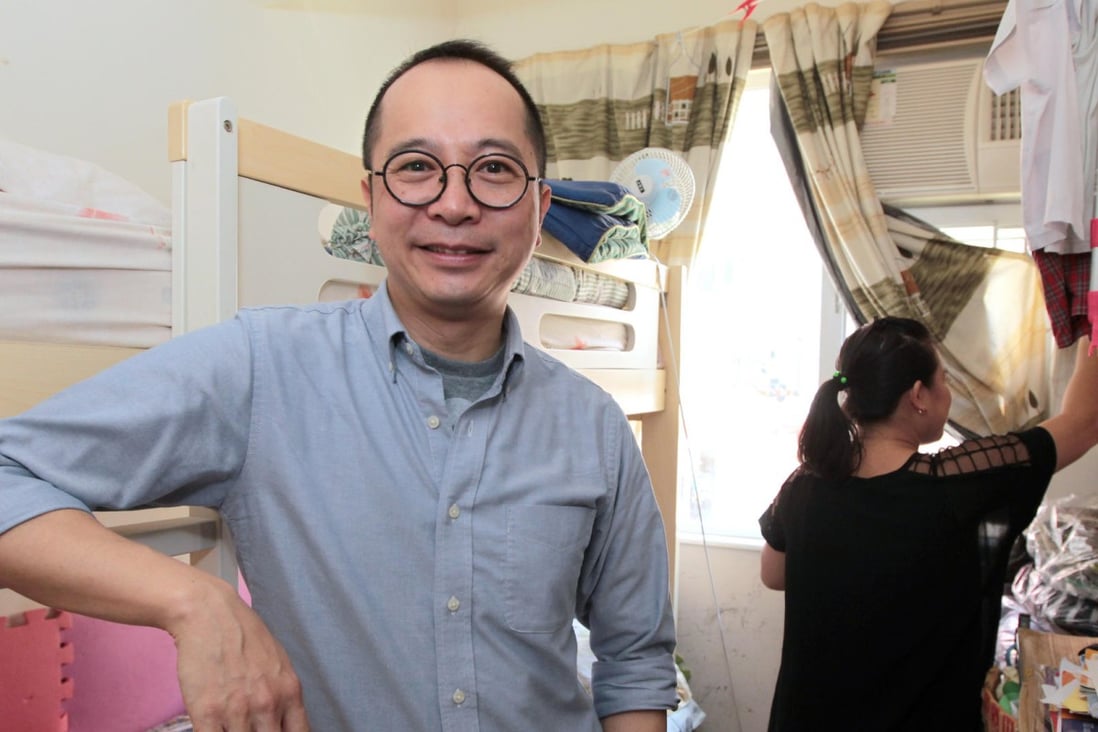 Light Be founder Ricky Yu stands in the Sheung Wan flat which is rented by single mother Wendy, who is standing by the window. Photo: Bruce Yan