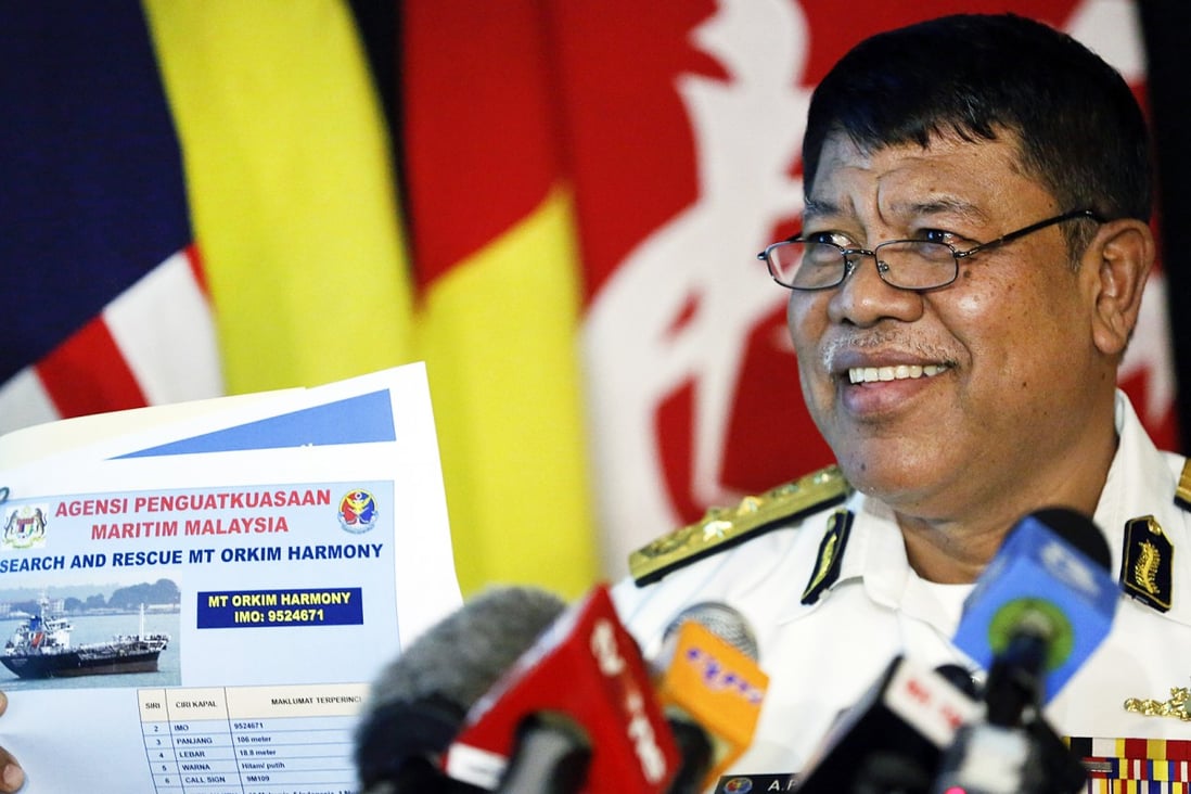 The deputy director of the Malaysian Maritime Enforcement Agency, Ahmad Puzi Abdul Kahar, show a picture of missing tanker. Photo: AP