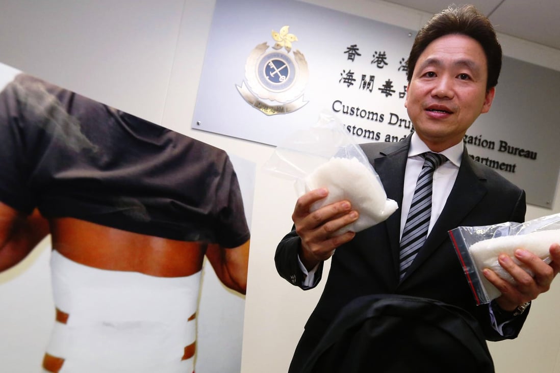Customs assistant commissioner Albert Ho demonstrates methods of smuggling crystal meth across the border. Photo: Nora Tam