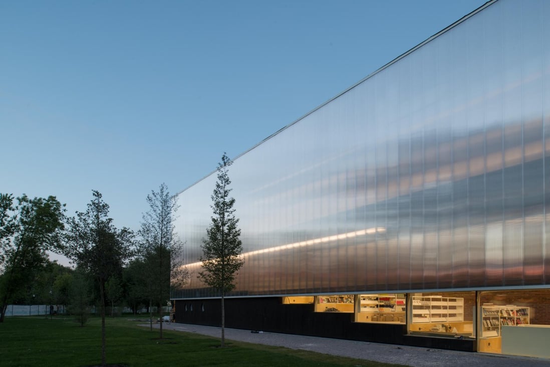 The Garage after the renovation by Rem Koolhaas, with a translucent polycarbonate 'skin' on its facade that reflects the surrounding trees. Photo: SCMP Pictures