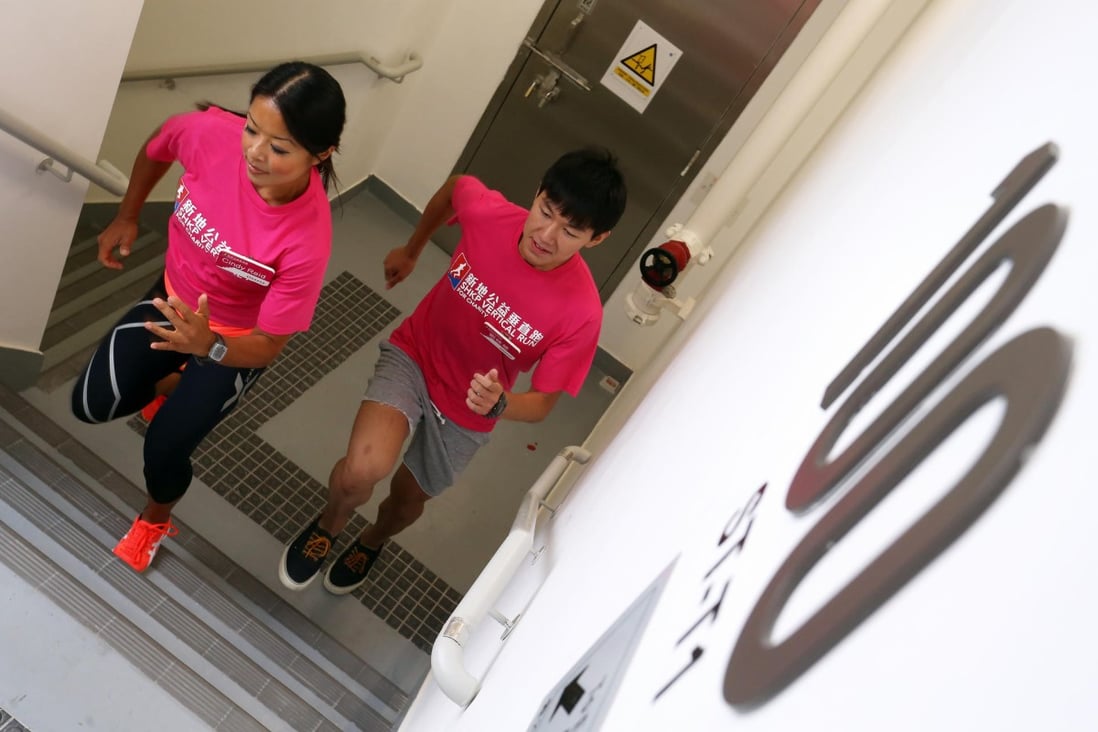 Reigning Sun Hung Kai Properties Vertical Run champion Cindy Reid (left) and fellow runner Lau Tsun-ling hit the stairs at the ICC in West Kowloon yesterday. Photo: Dickson Lee