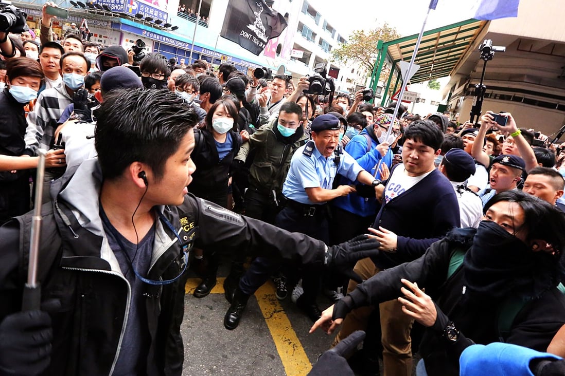 Police clash with localist groups during an anti-parallel goods trading protest in Yuen Long on March 1. A 17-year-old schoolboy accused of hitting a policeman with a restaurant door amid the chaos has been acquitted by a court. Photo: Felix Wong