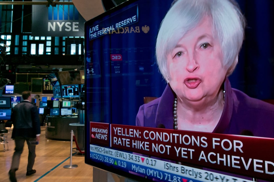 Traders in New York monitor a screen showing US Federal Reserve chairman Janet Yellen which will determine this year an interest rate rise. Photo: AP