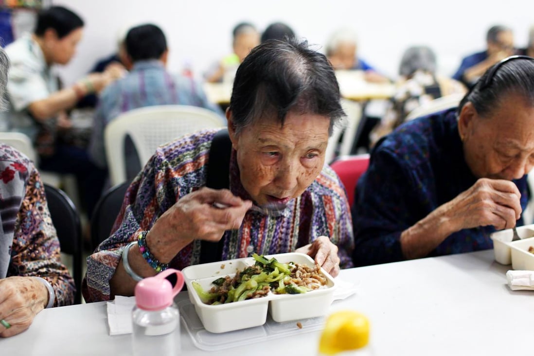Elderly residents enjoy the nourishing results at one of the programme’s centres. Photo: SCMP pictures
