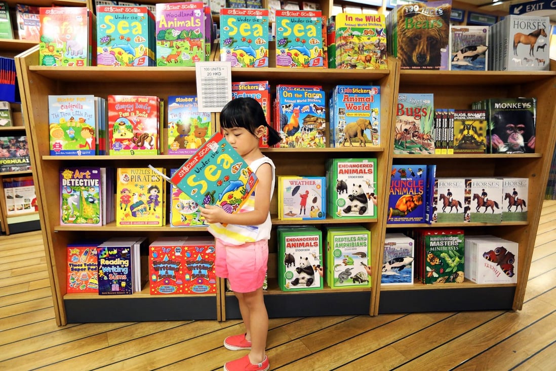 A child with an appropriate book for the fair. Photo: Nora Tam