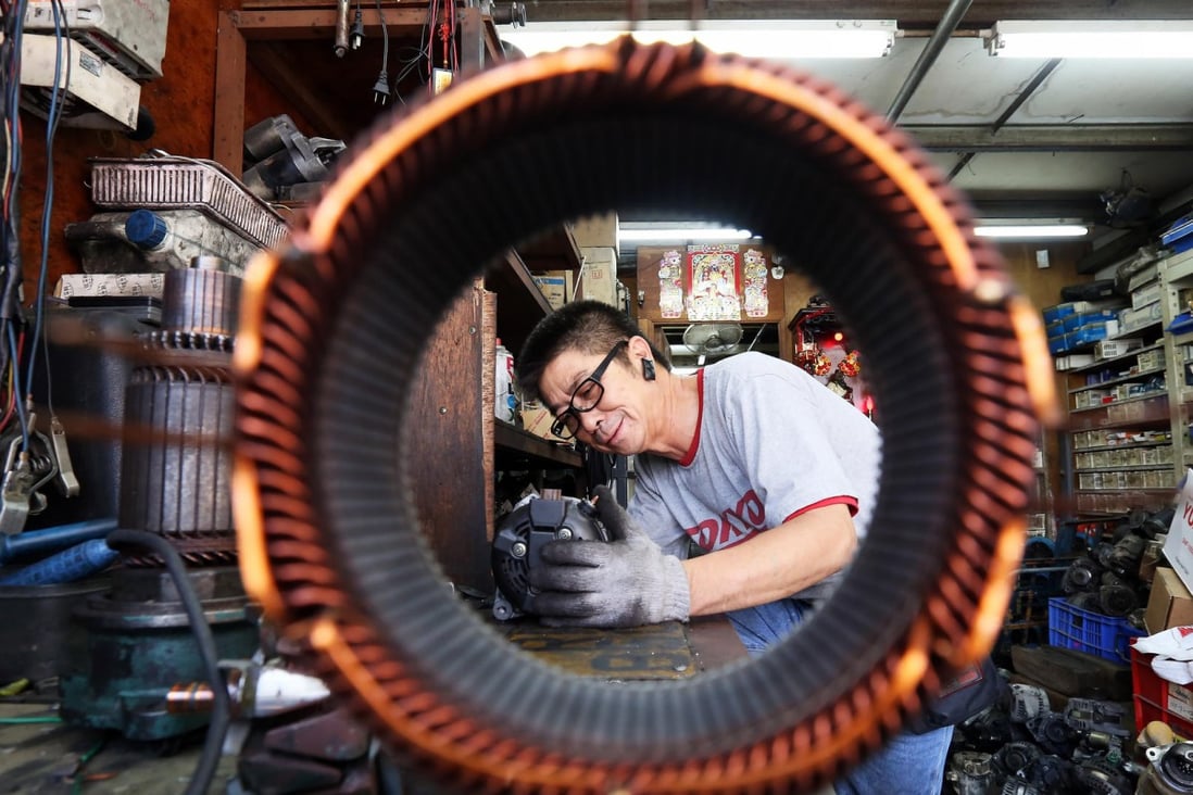 Car mechanic Lau Chun has been running his garage in Yuen Long for more than 30 years and says he is too old to learn a new trade. Photo: Dickson Lee