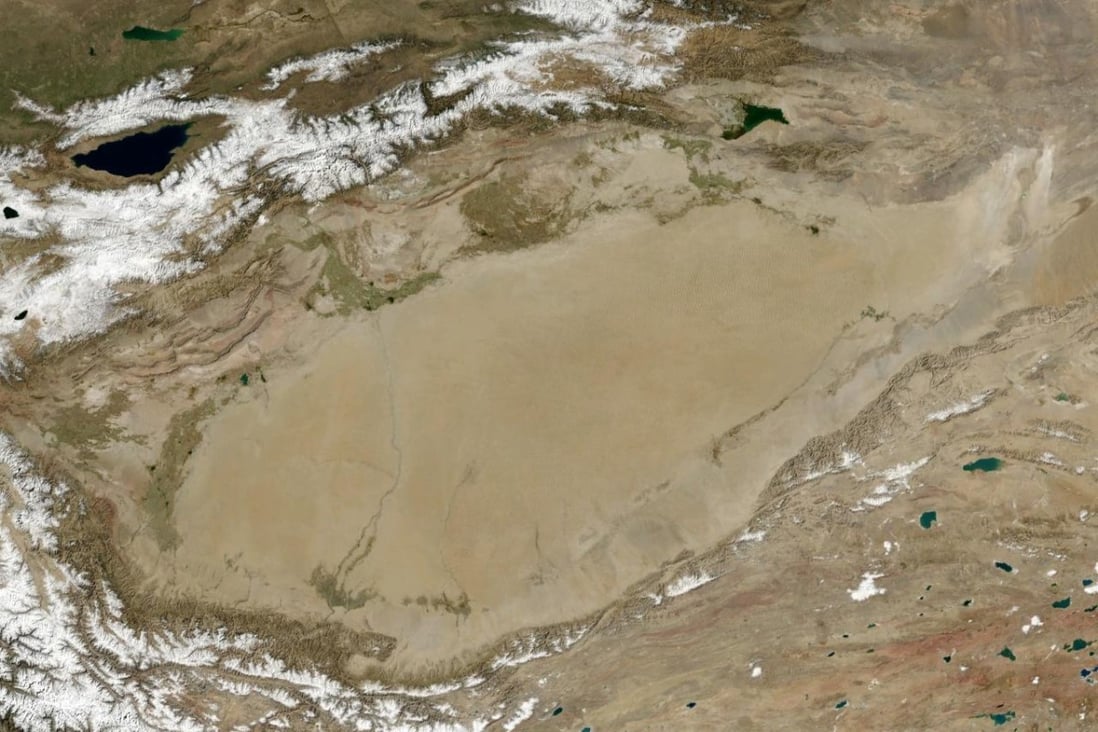 Chinese scientists say a huge ocean underneath Xinjiang's Tarim basin acts as a major carbon sink, protecting us from even greater global warming. Photo: Nasa