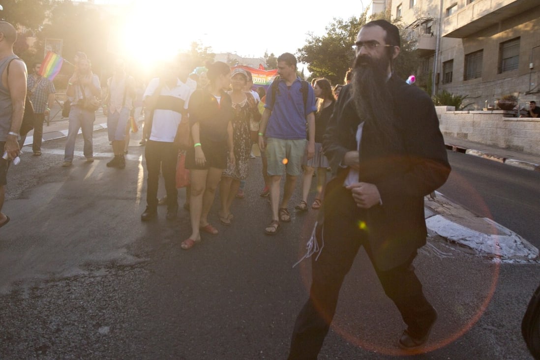 https://img.i-scmp.com/cdn-cgi/image/fit=contain,width=1098,format=auto/sites/default/files/styles/1200x800/public/2015/07/31/ap_aptopix_mideast_israel_gay_parade_attacking_seb1_51712881.jpg?itok=uEWL8Nqj%20