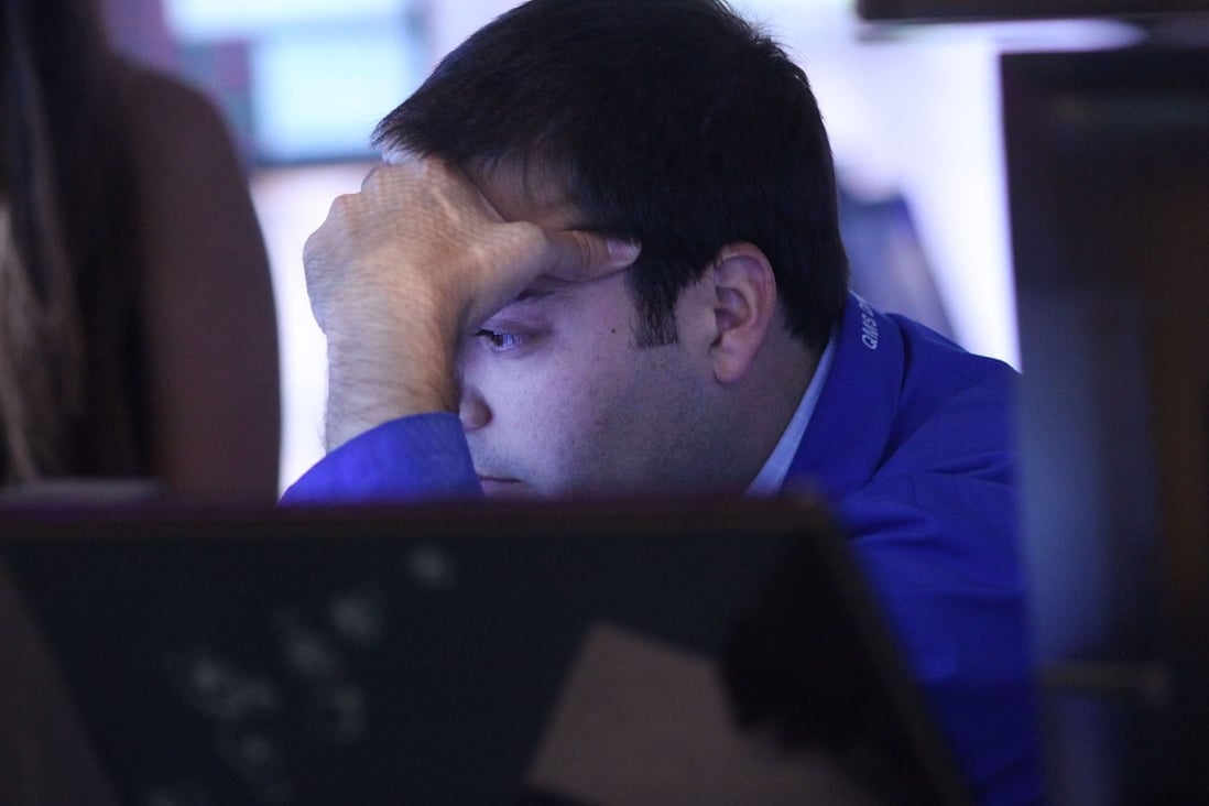 A worried investor on Wall Street stares at his screen as investors brace for likely US interest rate increases as soon as next month. Photo: AFP