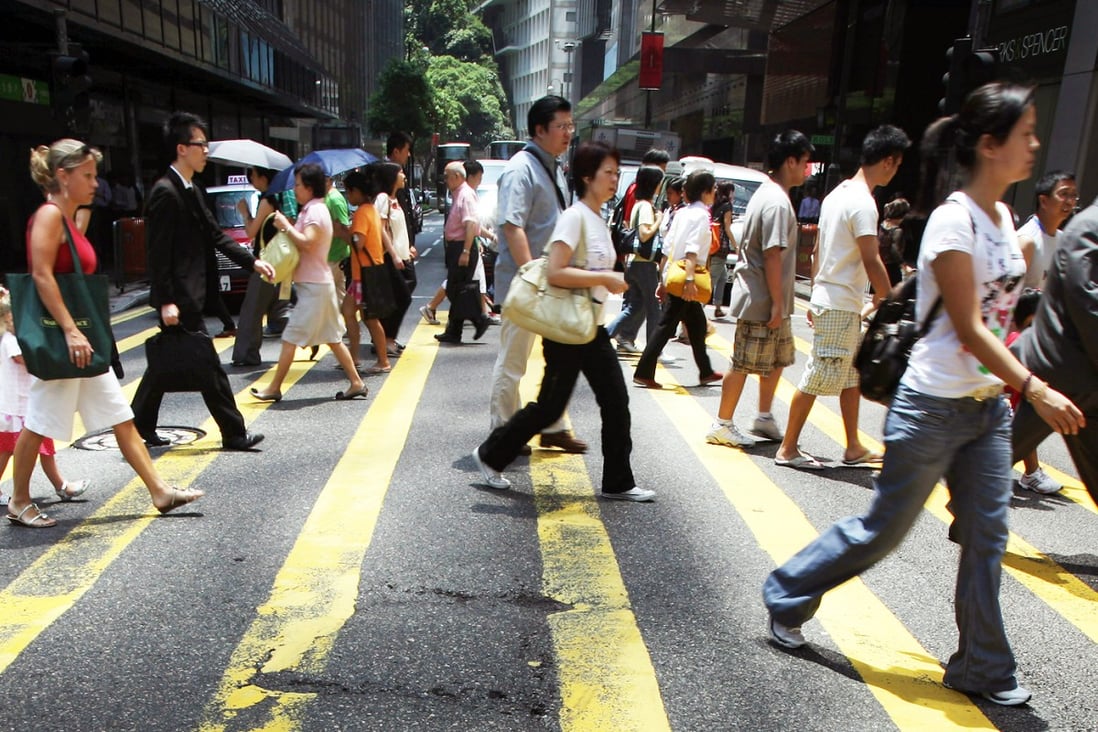 More than six in 10 employees in Hong Kong polled said they are unhappy at work and almost half of them said they intended to change jobs in the next 12 months, according to a survey carried out by a job-seeking website. Photo: AFP