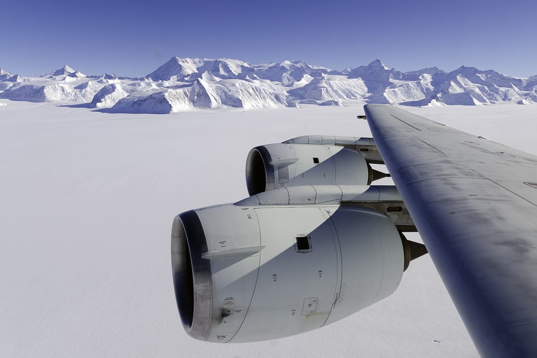 A Nasa flying laboratory surveys Antarctica's ice sheet.  A new study says that burning all the world’s fossil fuel reserves could push up world sea levels by more than 50 metres over thousands of years.  Photo: AFP 