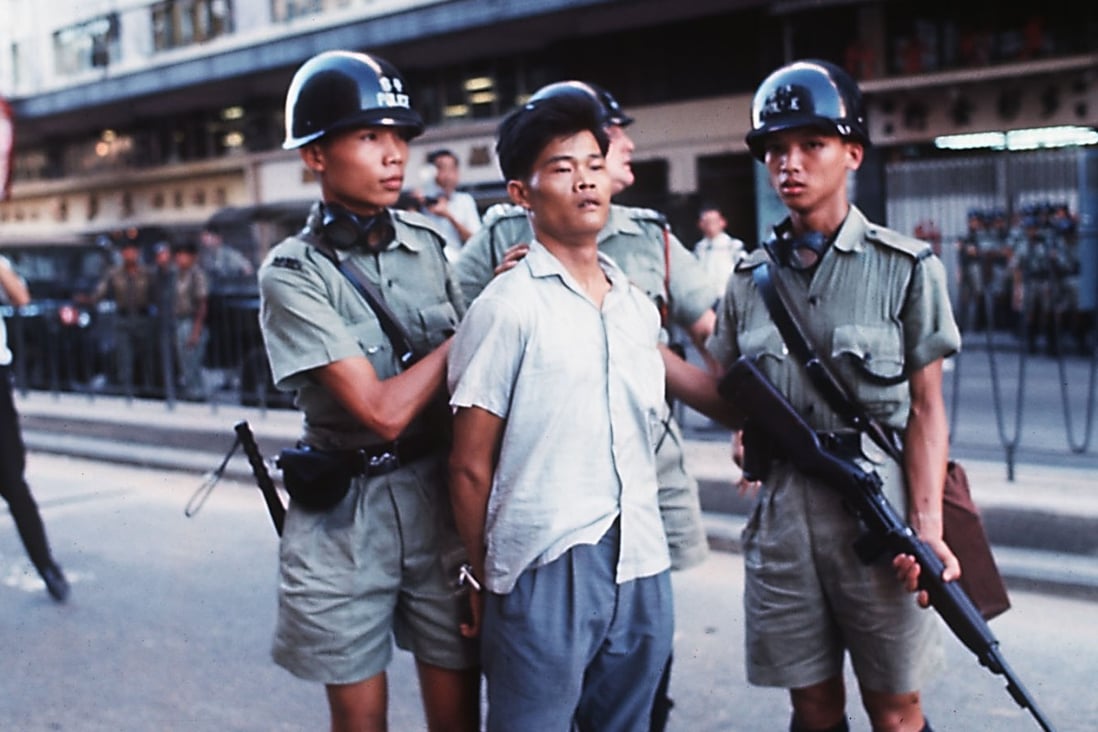 A man is taken into custody by police during the 1967 riots that tore through Hong Kong. Photo: SCMP Pictures