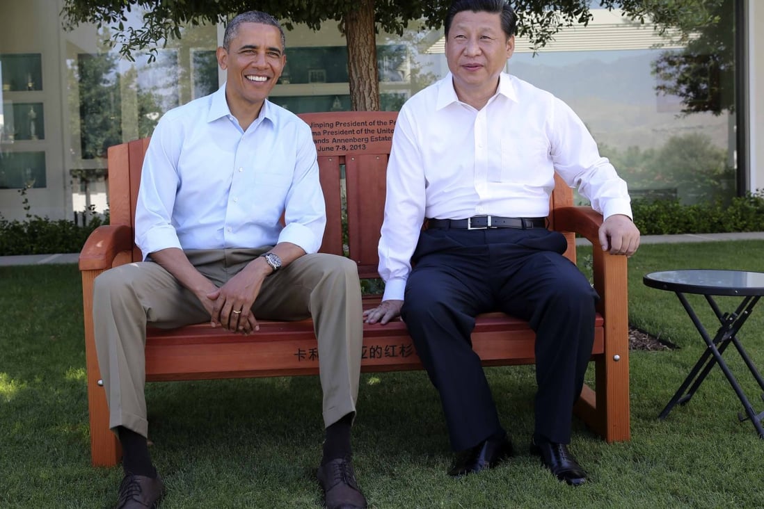 Barack Obama presents Xi Jinping with a bench made of California redwood before they head into their meeting at the Annenberg Retreat in June 2013. Photo: Xinhua