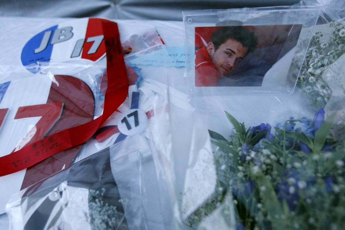 A photo of  Jules Bianchi  and flowers at a stand especially set up beside the track at the Suzuka circuit. Photo: Reuters
