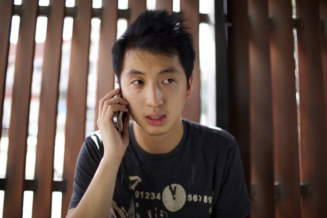 Anthony Kwan Hok-chun speaks on the phone after leaving Samut Prakan provincial court in Thailand after he was released on bail on August 24. The crime he has been accused of carries a maximum penalty of five years in gaol. Photo: AP 