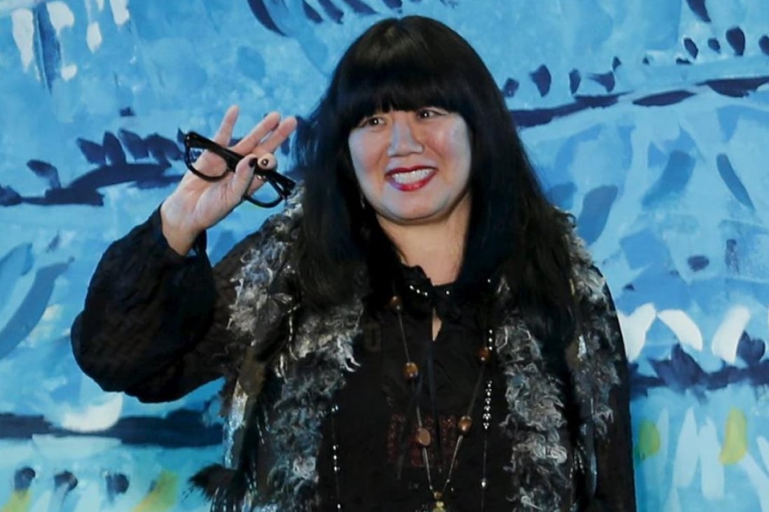 Anna Sui acknowledges the applause after presenting her latest collection in New York in September. Photo: Reuters