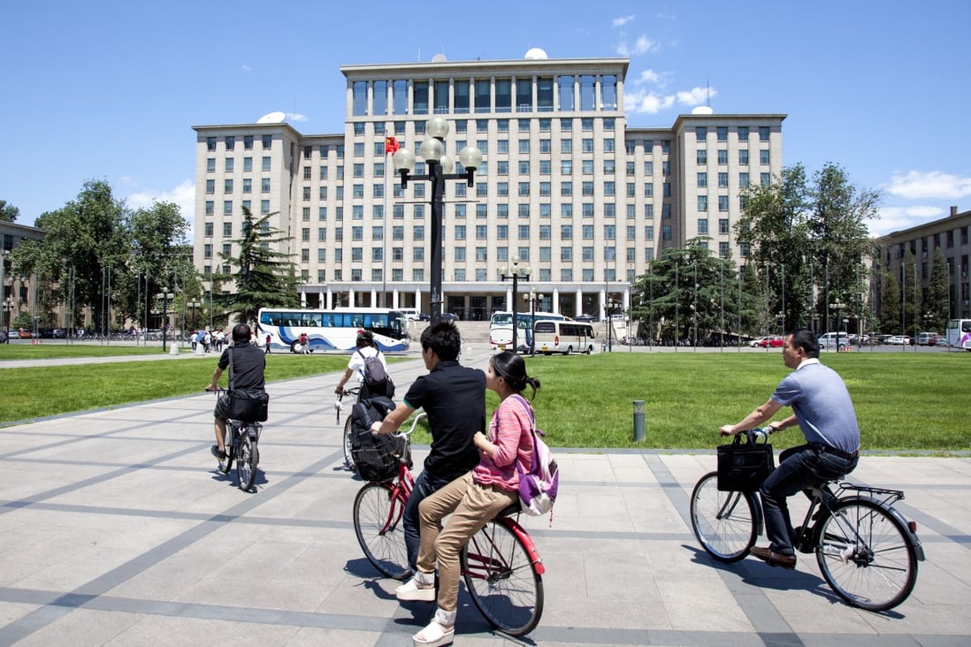 Students cycle past around the Tsinghua University campus in Beijing. Photo: SCMP Pictures