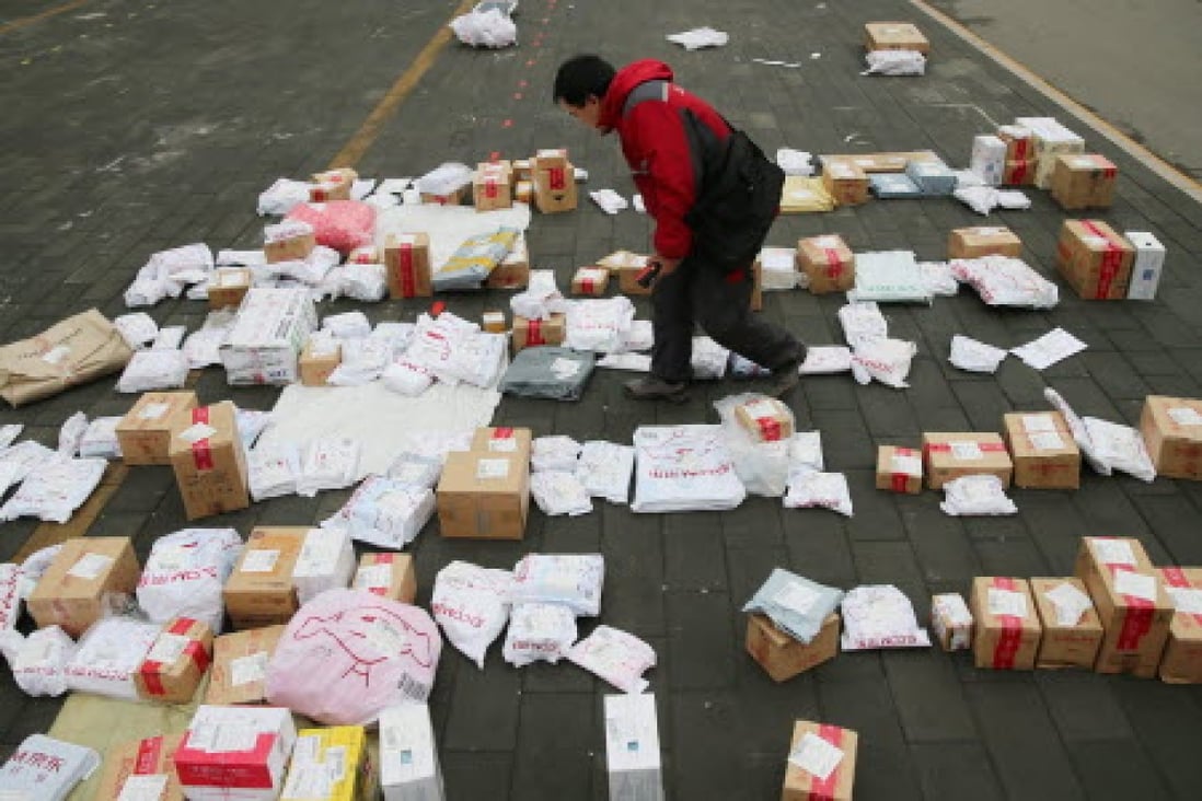 A JD.com employee sorts out parcels at a university in Beijing on Singles Day last week. Photo: EPA