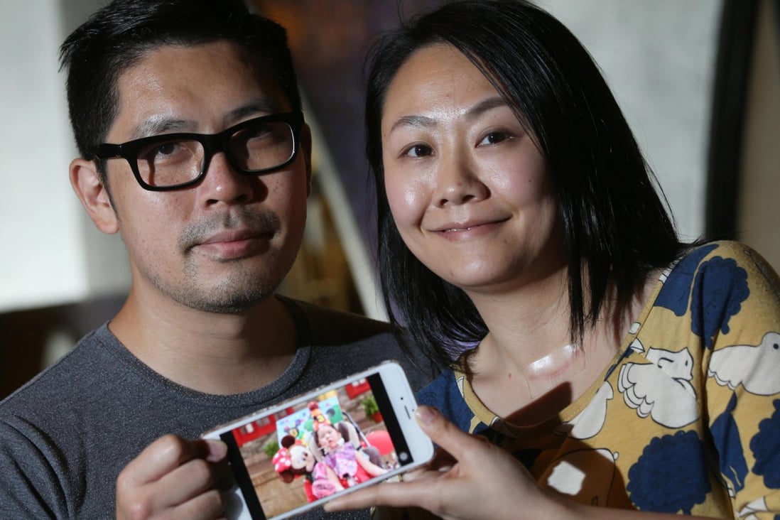 Gary and Hilda Hui with a photo of their three-year-old daughter, Abigail. Photo: K. Y. Cheng