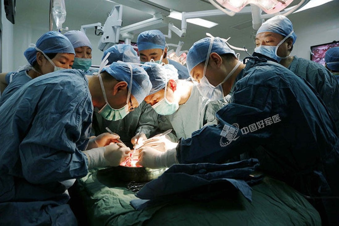 Surgeons operating during the transplant. Photo: SCMP Pictures
