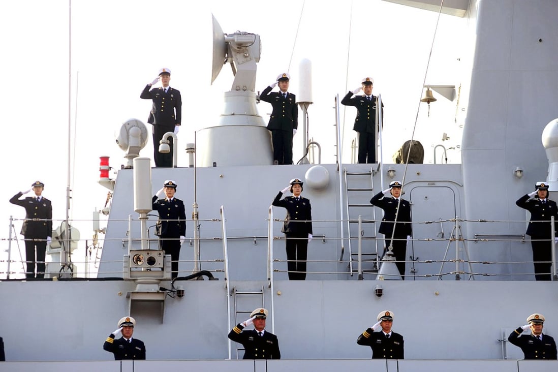 Chinese navy soldiers wave to bid farewell at a port in Qingdao, Shandong. Photo: Xinhua