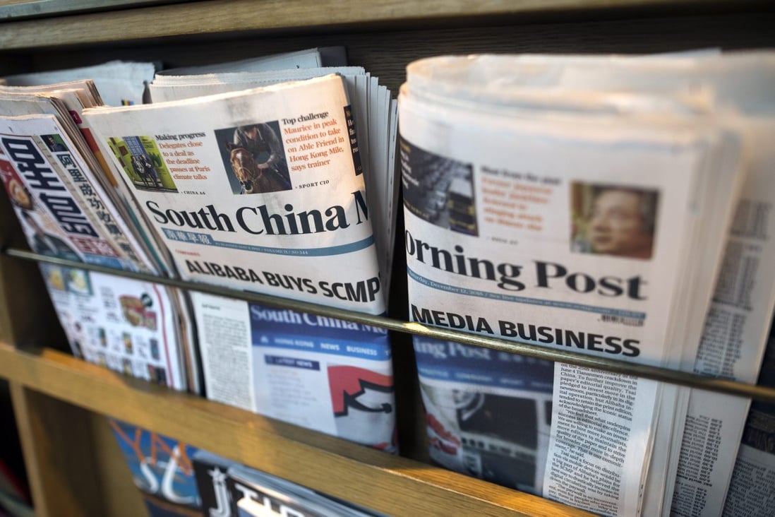 Copies of the South China Morning post on a news rack in Hong Kong. Photo: EPA