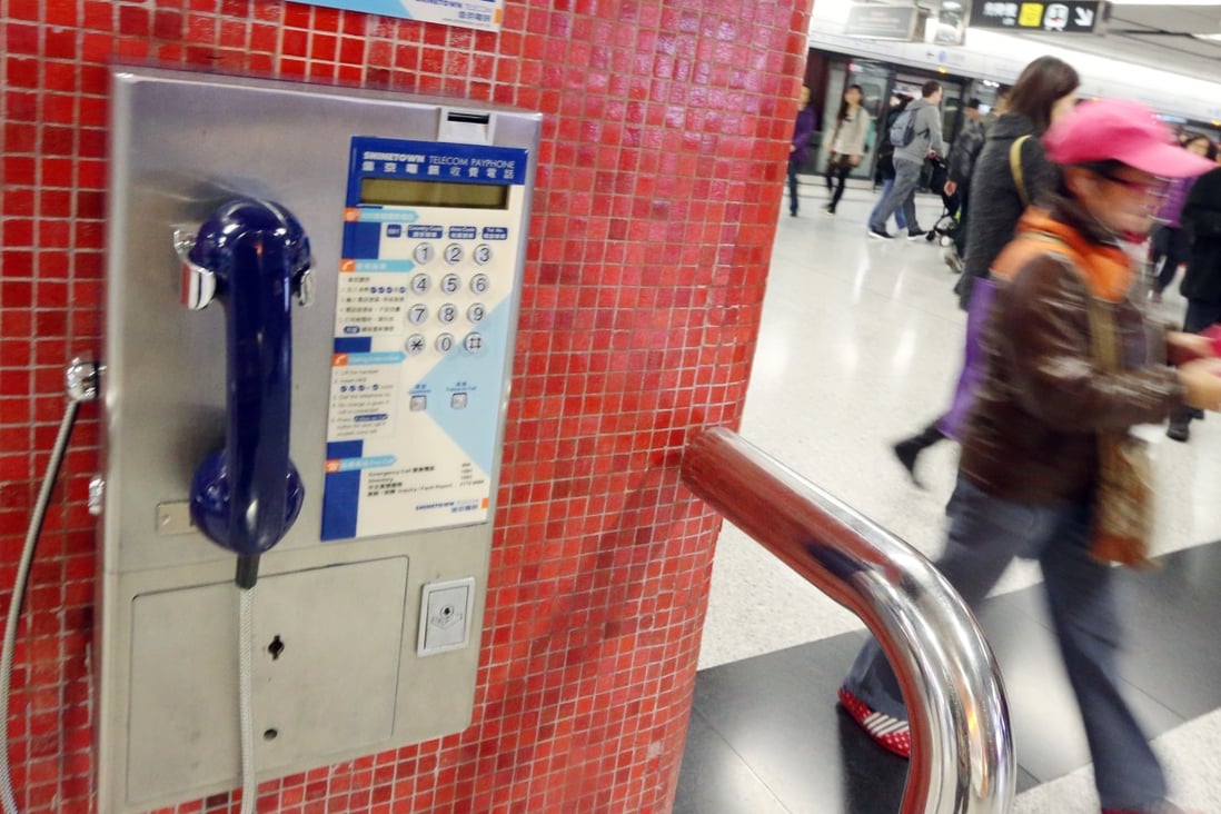 A public payphone is seen at a train station. MTR plan to remove all the payphones from the train station. Photo: Felix Wong