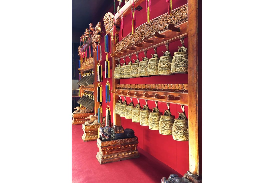 The deep green jade chimes and bronze bells used to play music for birthday celebrations in the Qing Court on display at the Hong Kong Museum of History.