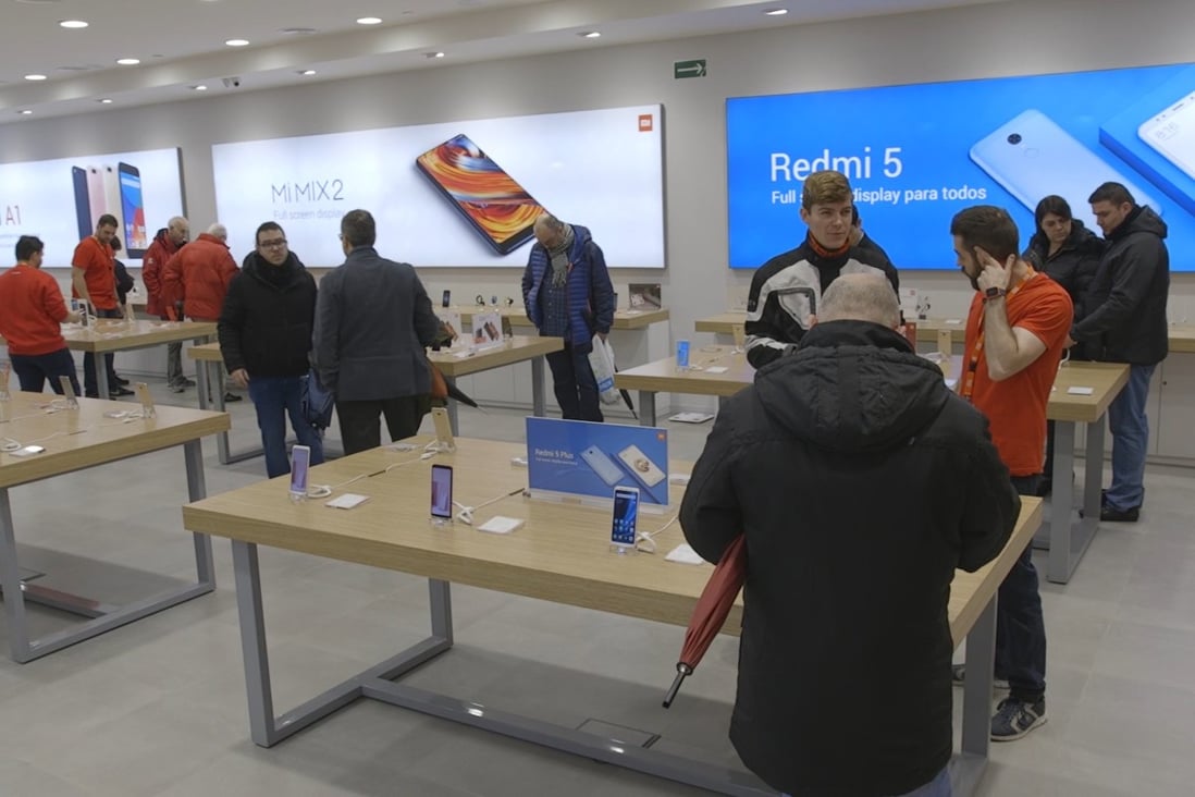 Smartphones on display at Xiaomi's new store in Barcelona, Spain