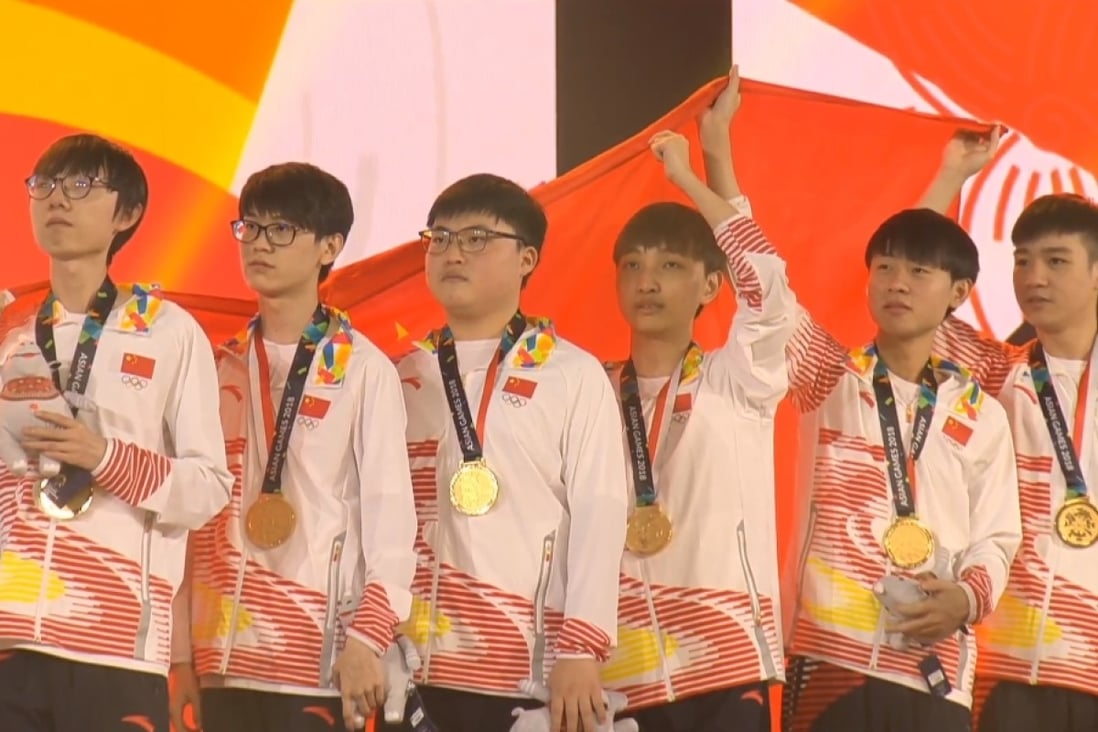 Uzi (third from left) is the captain of the team, and plays alongside two of his teammates from RNG. (Picture: Asian Games 2018)