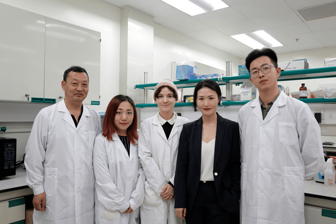 Dr Kelsey Zhongling, deputy executive director of ImmunoDiagnostics (second from right), and the company’s research team